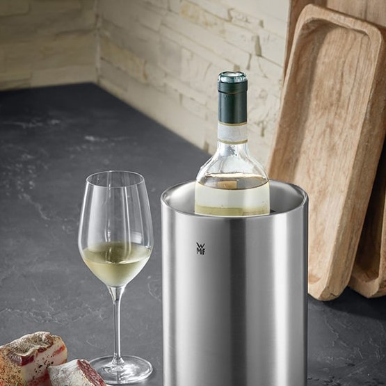 Wine Accessories - A fine collection of WMF wine accessories, including a wine cooler and a wine bottle
stopper.